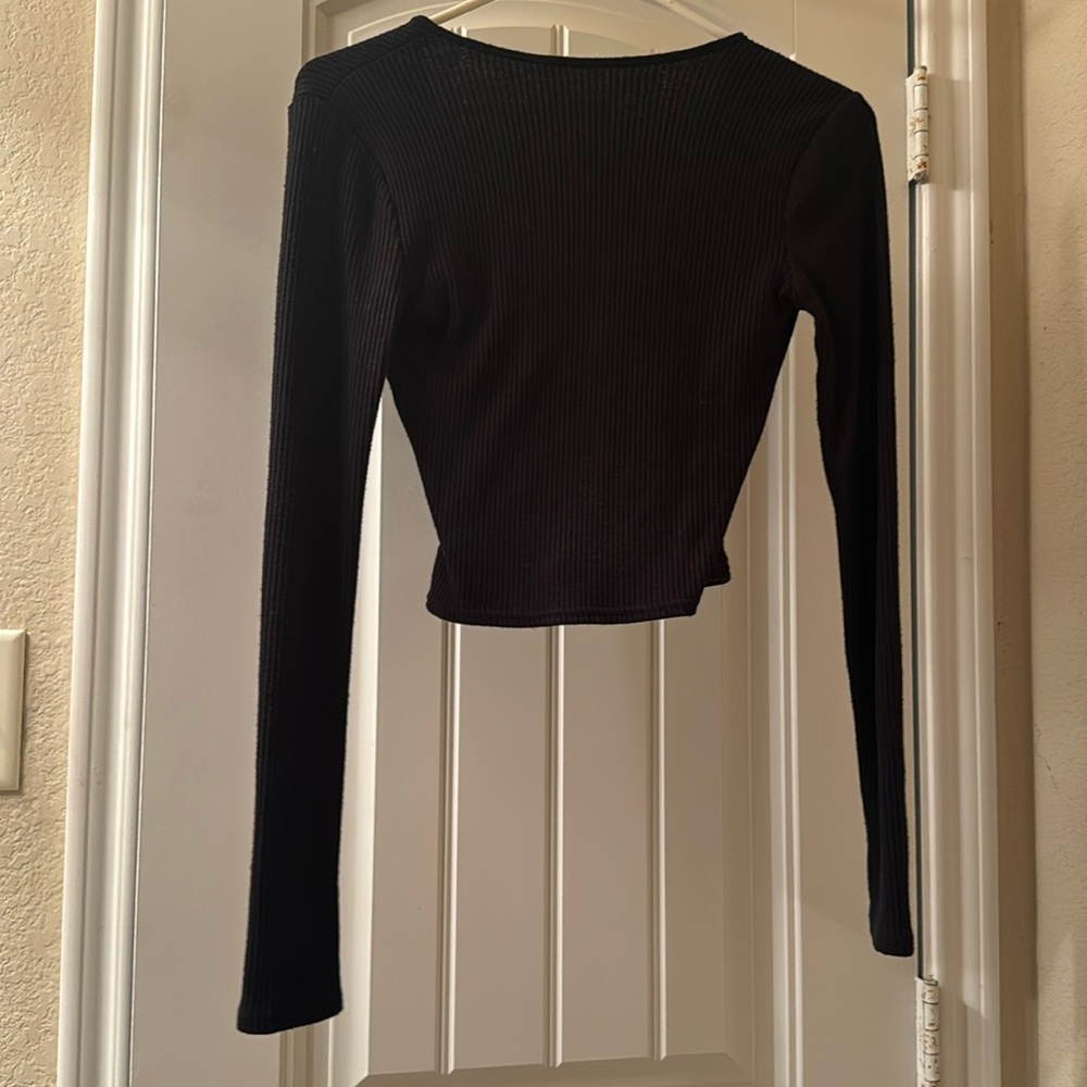 A Black opened chest long-sleeve shirt